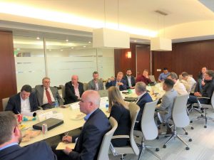 People sitting around a table in a board room